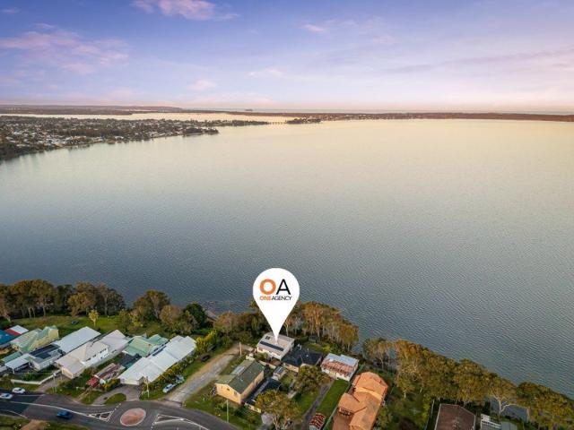 Absolute waterfront four bedroom home with private boat ramp