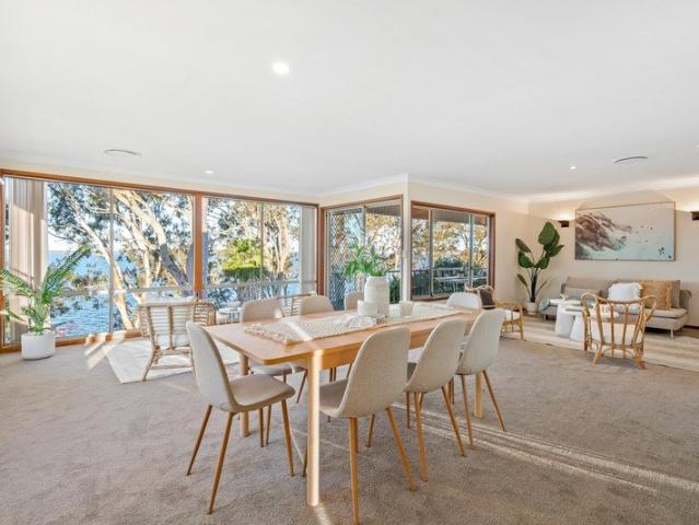Absolute waterfront four bedroom home with private boat ramp