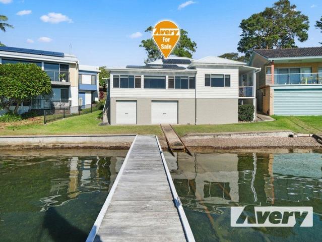 Absolute Waterfront Living with Front Row Lake Views