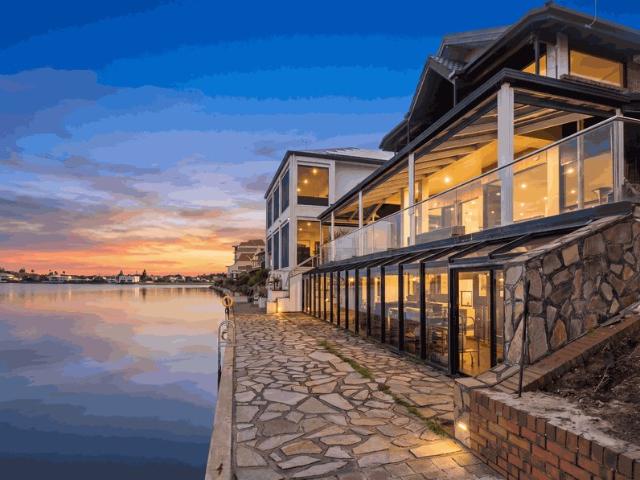 Absolute East Facing Lakefront with Renovation Potential