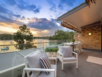 Absolute Waterfront Living in Prestigious Sandpipers