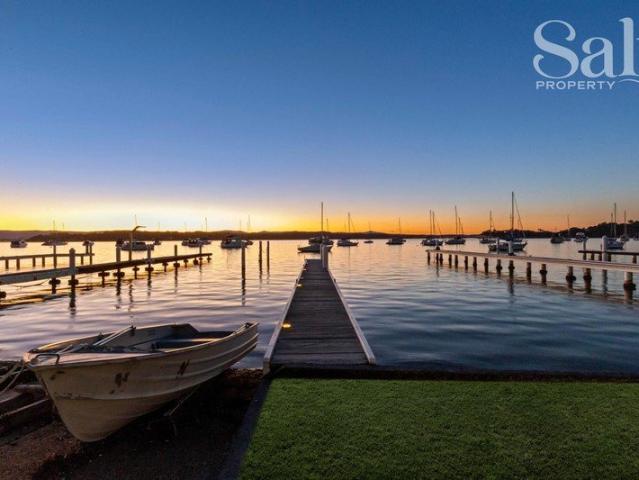 Absolute waterfront renovated family home with jetty