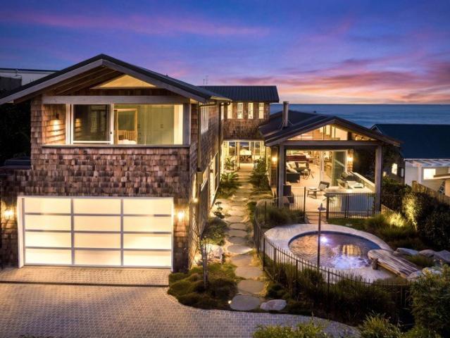 Absolute beachfront splendour with two family homes