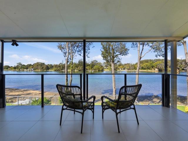 Absolute Riverfront Living With Private Boatshed, Pool & Endless Lifestyle Appeal