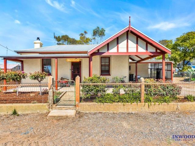 Affordable and charming character stone home in prime Palmer location, large block, sheds, outdoor entertaining area