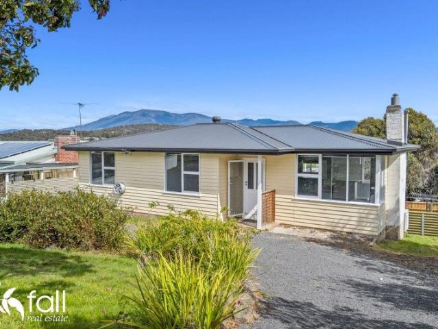 Affordable, sunny with great mountain view and potential