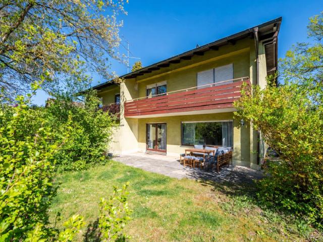AIGNER Charmante Doppelhaushälfte mit weitläufigem Garten und Westausrichtung in Waldperlach