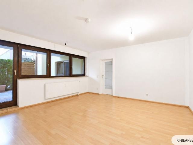 AIGNER Großzügige 3 Zimmer Erdgeschosswohnung mit Terrasse in Alt Perlach!