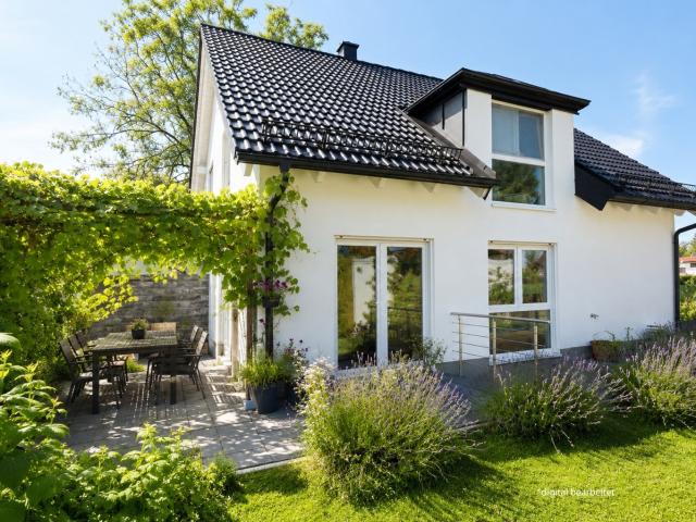 AIGNER Energieeffiziente Doppelhaushälfte mit idyllischem Garten Erbpacht