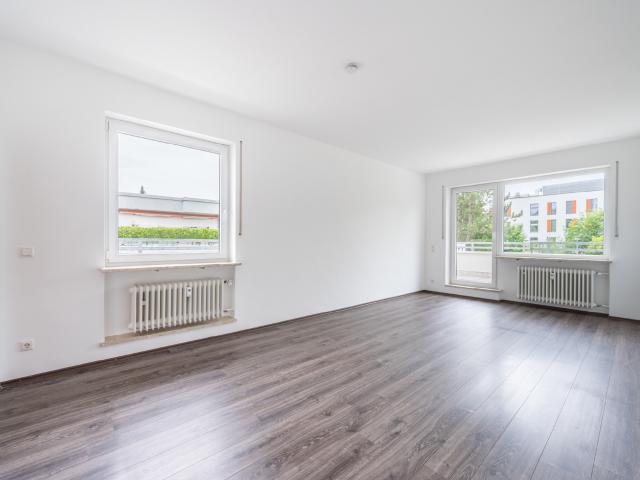 AIGNER Helle 3 Zimmer Wohnung mit großzügiger umlaufender Dachterrasse im Fasangarten