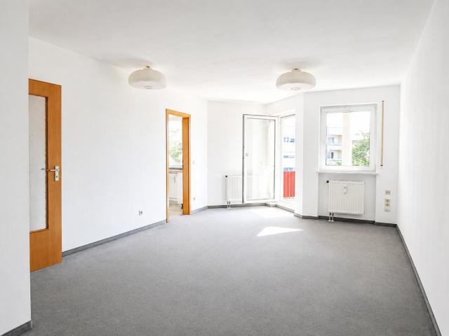 AIGNER Lichtdurchflutetes Dachgeschoss Apartment mit Balkon