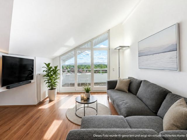 AIGNER Moderne Dachgeschosswohnung mit Bergblick in Starnberg Söcking