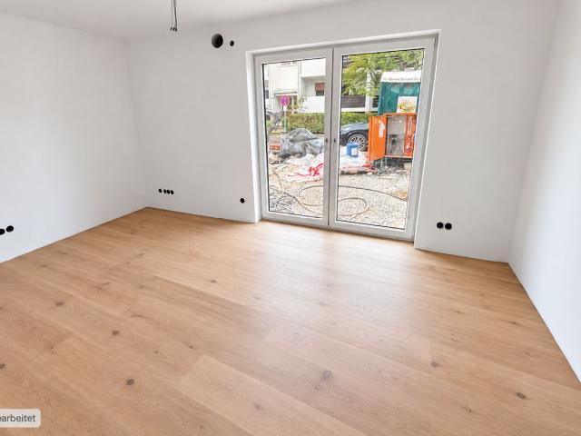AIGNER Neubau Erstbezug: 4 Zimmer Erdgeschosswohnung mit Garten in Solln!