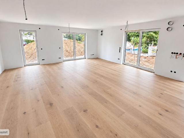 AIGNER Neubau Erstbezug: 3 Zimmer Erdgeschosswohnung mit Garten in Solln!