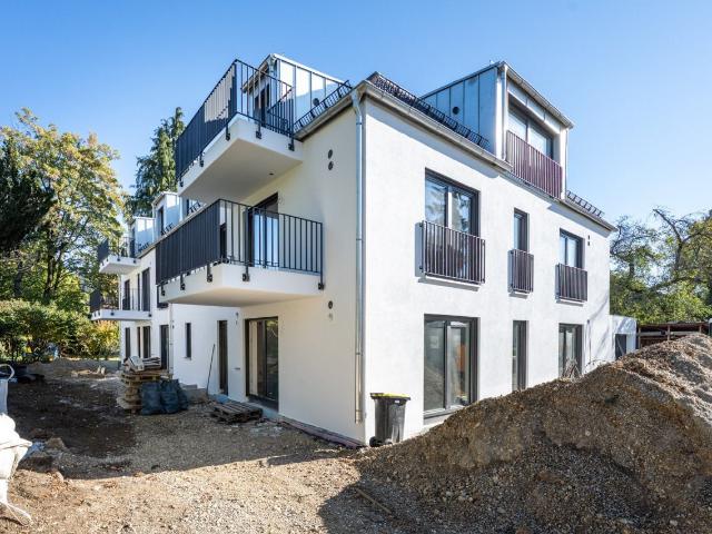 AIGNER Neubau Erstbezug: Helle 2 Zimmer Dachgeschoswohnung mit Balkon in Solln!