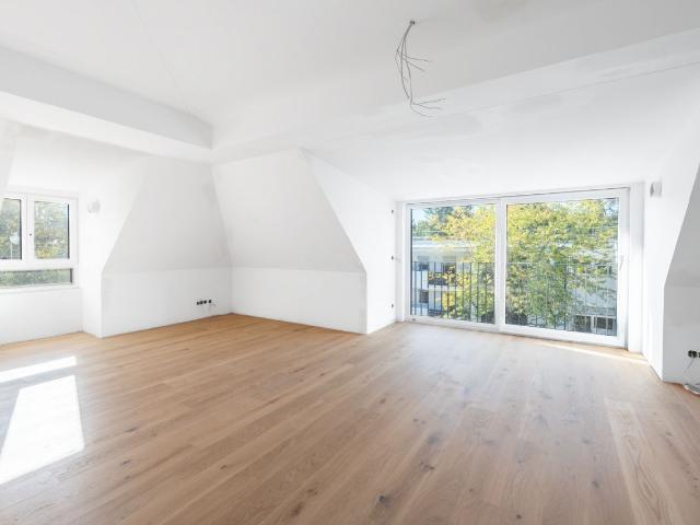 AIGNER Neubau Erstbezug: Helle 3 Zimmer Dachgeschoswohnung mit Balkon in Solln!