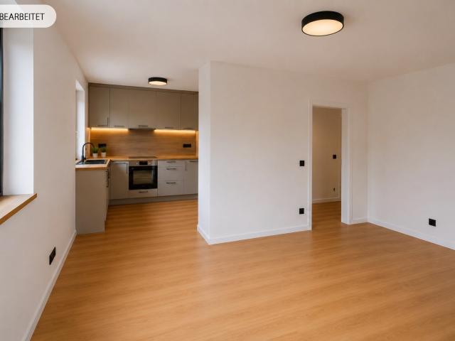 AIGNER Sonnige 2 Zimmer Gartenwohnung mit Balkon und schönem Süd West Garten