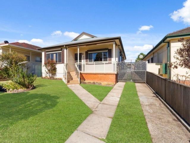 Air Conditioned Three Bedroom Home with Updated Kitchen and Tiled Living Areas!