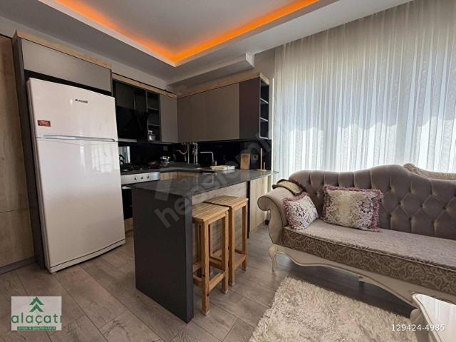 Alaçatı'danARAKATTAİSKANLIBALKONLUEŞYALI SATILIK 2+1 DAİRE