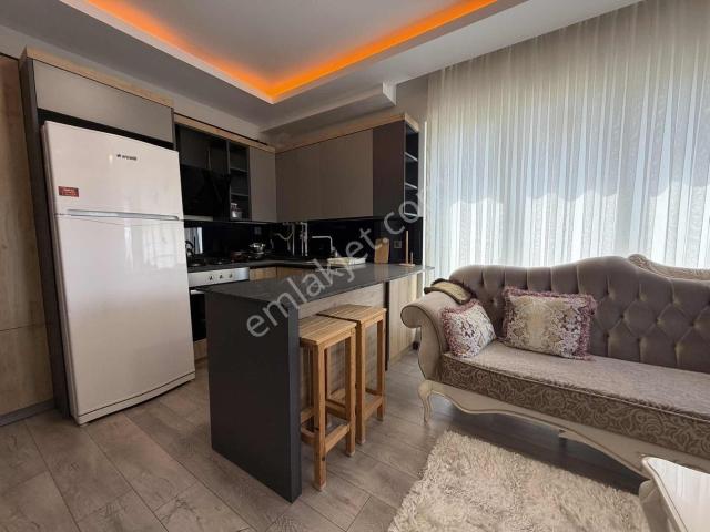 Alaçatı'dan/arakatta/iskanlı/balkonlu/eşyalı Satılık 2+1 Daire