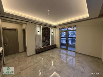 alaçatı JEWEL AVM KARŞISI ARAKAT ÖN CEPHE ŞIK TASARIM 2+1 DAİRE