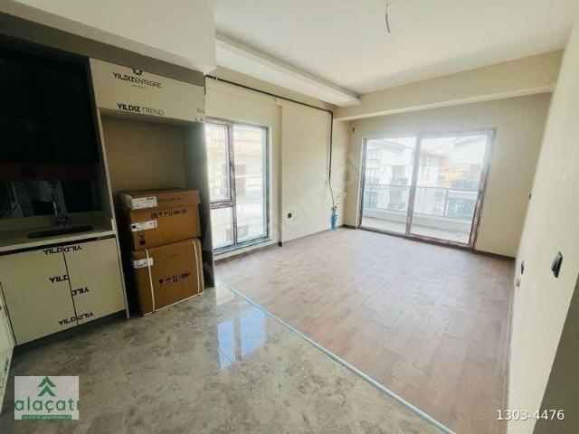 ALAÇATI'DAN MERKEZİ KONUM YERDEN ISITMA SATILIK 1+1 DAİRE