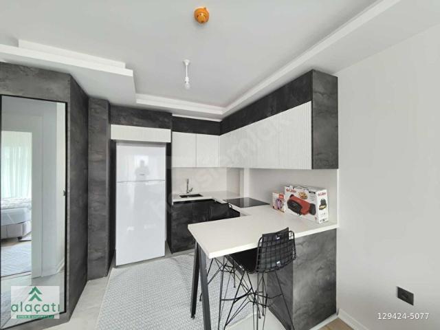 ALAÇATI'DAN SİTE İÇİ ARAKAT GÜNEY CEPHE CAMBALKON FULL ESYALI1+1