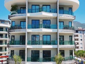 ALANYA MERKEZ 1+1 50M2 EŞYASIZ AKTİVİTELİ DENİZE YAKIN DAİRE