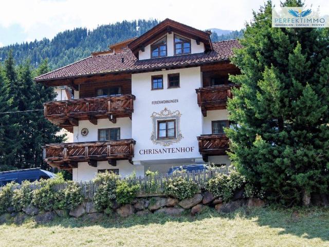 Alpines Wohn und Apartmenthaus in exklusiver Pistenlage