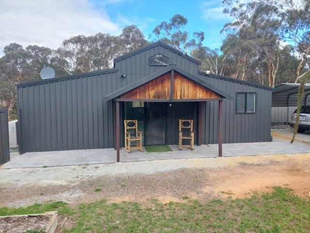 American Barn House Weekender on small acreage with potential to build.