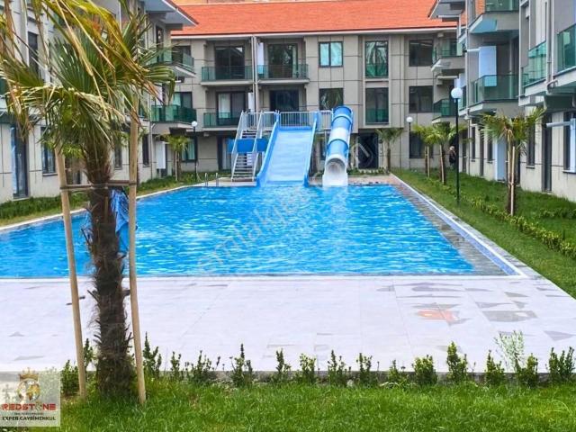 Çamlık1 Sitesinde Bahçe Kullanımlı Eşyalı 1+1 Satılık Daire