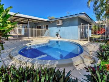 AMPLE OPEN PLAN LIVING WITH INGROUND SWIMMING POOL