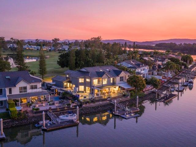 An Ultra Rare Riverfront & Golf Course Position Spectacularly Renovated