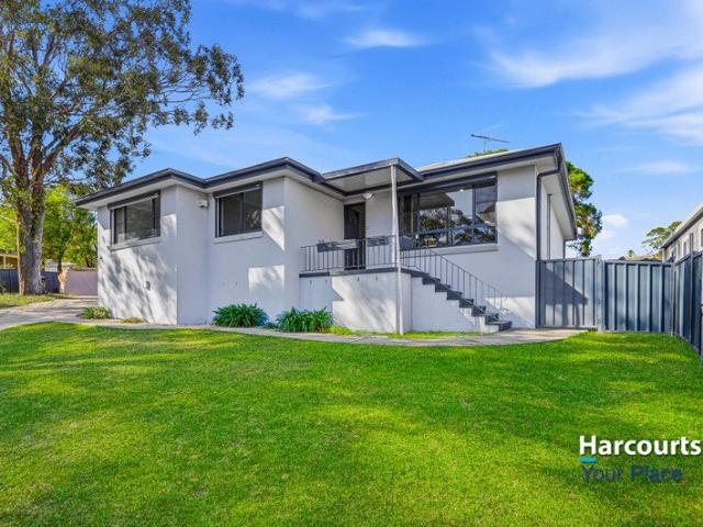 An Updated Home, Two Beautiful Bathrooms & An Entertainer's Deck!