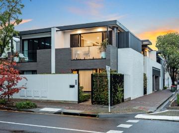 An award winning, forward thinking corner townhouse, cut from Norwood's past