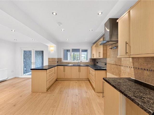 An eight bedroom family home across three floors, with a large rear garden, driveway parking and an integrated garage in Hampton in Arden