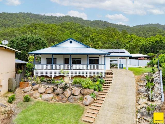 An elevated family home with commanding views, a resort style pool, and a position that is as quiet as it is connected