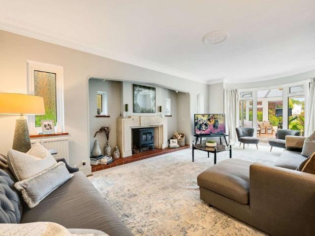 An elegant family home on a prestigious private road with superb west facing garden