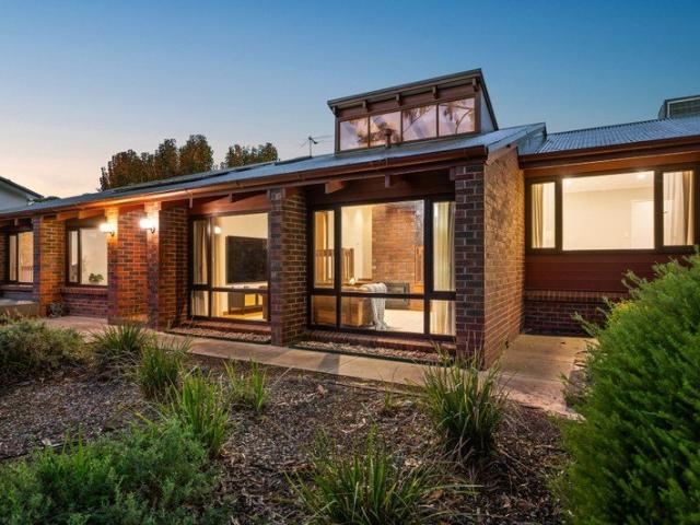 An Exceptional Three Bedroom Haven with Stunning Raked Ceilings and Exposed Brick Features.