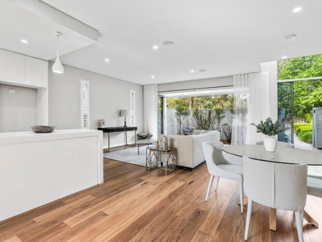 An exceptional townhouse with rare spatial flexibility and a coveted village connection
