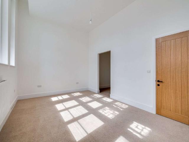 An exceptional two bedroom apartment offering impressive proportions, and soaring ceilings seamlessly blending period character with contemporary living