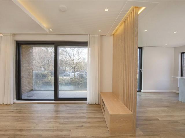 An exceptional two bedroom apartment with balcony overlooking the river located in the city centre