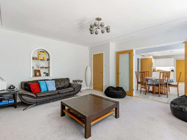 An exceptional detached home which has been substantially extended and comprehensively refurbished to create a beautifully appointed family home, set within mature private grounds