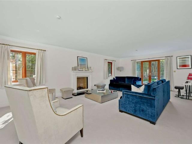 An exceptional five bedroom detached family residence with triple garage, games room and magnificent private gardens