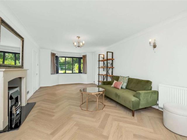 An exceptional four bedroom home offering generous living space, a private driveway and an extensive rear garden, positioned within a sought after residential setting