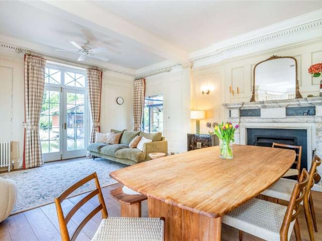 An exceptional seven bedroom Lutyens style country house set within a private gated estate in Hurley, with landscaped gardens, a picturesque lake and two studio annexes
