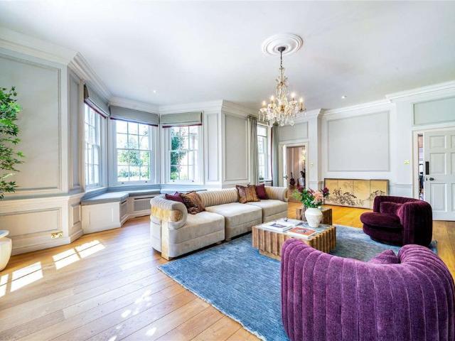 An exceptional seven bedroom Lutyens style country house set within a private gated estate in Hurley, with landscaped gardens, a picturesque lake and two studio annexes