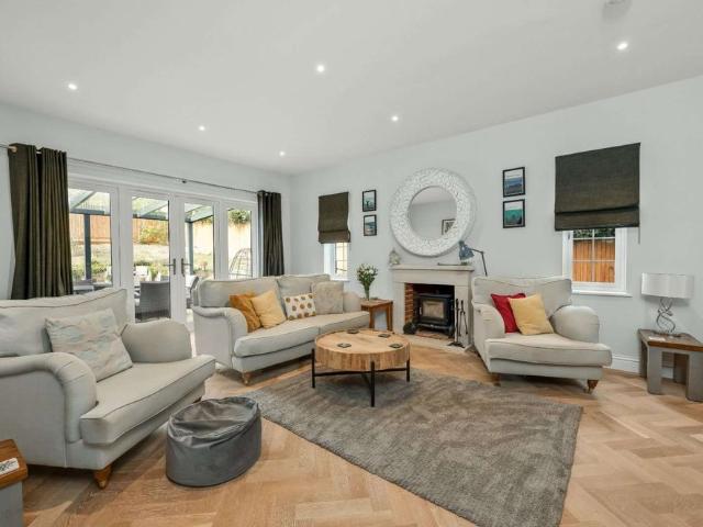 An exceptional six bedroom family home occupying a delightful edge of village position within an exclusive development, enjoying countryside views and extensive outdoor entertaining space