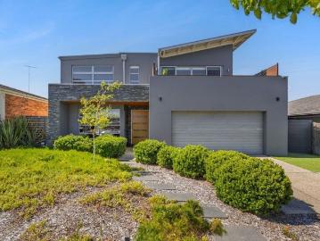 AN EXPANSIVE FAMILY HOME IN A COVETED TREE LINED SETTING