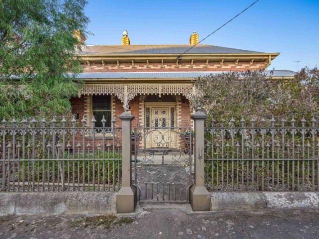 An Exquisite Victorian Residence with a Commanding Street Presence